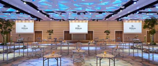 Hilton Tokyo Bay ballroom featuring modern ceiling lighting for corporate events and conferences.