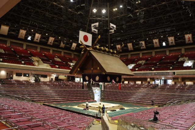 Kokugikan Arena with suspended architectural ceiling for 360-degree event and concert staging.