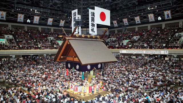 Kokugikan arena 360-degree central stage for sold-out concert and live event production.