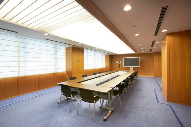 U-shaped board meeting room at National Museum of Nature and Science for corporate strategy sessions.