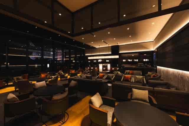 Modern hotel lounge with modular seating for high-end networking and corporate cocktail events.