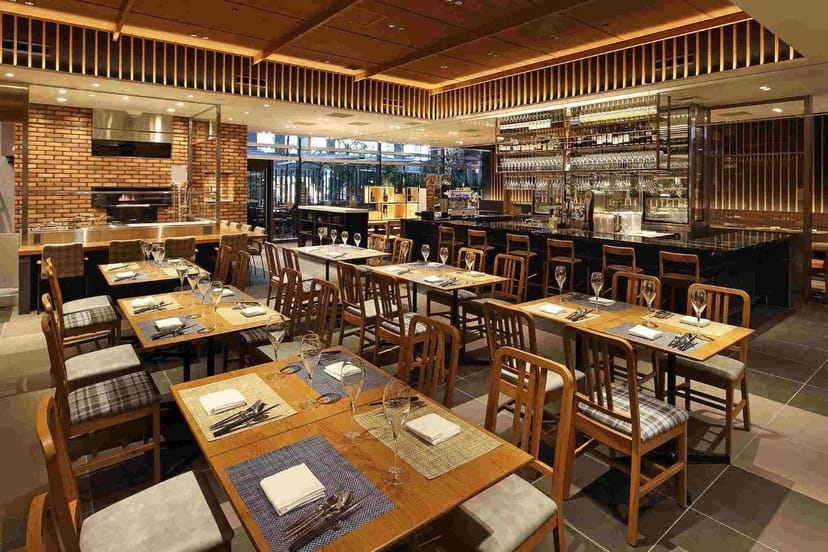 Upscale industrial Italian eatery at Hotel Gracery Shinjuku for corporate receptions and events.