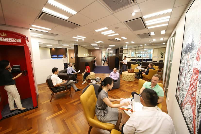 Virtual office breakout area with tiered seating for agile collaboration and corporate networking.
