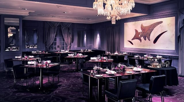 Upscale private dining at La Table de Joël Robuchon with elegant chandeliers for VIP events.
