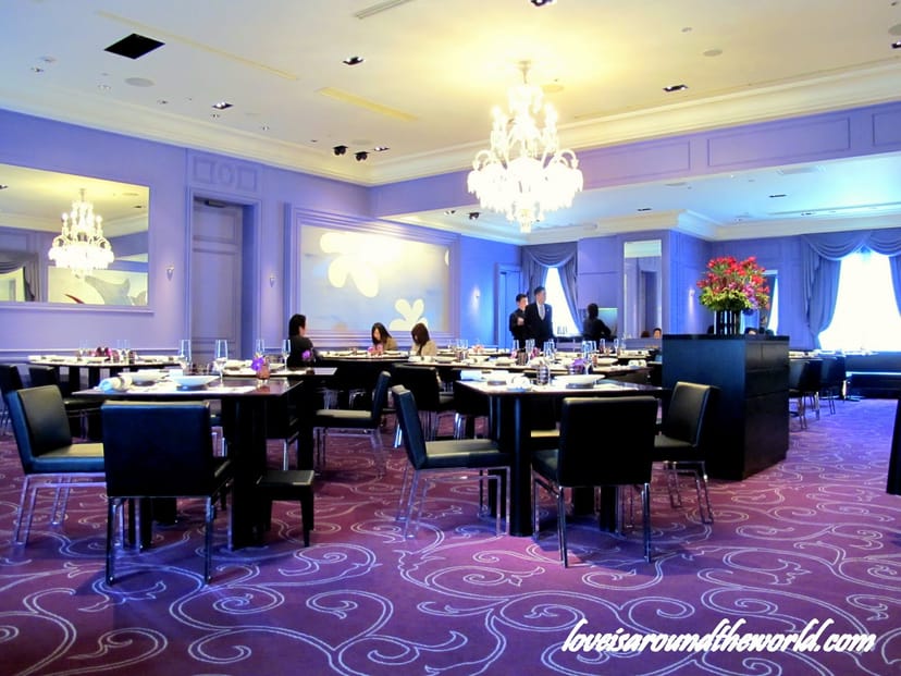 Lavender-themed luxury banquet room at Chateau Restaurant Joel Robuchon for corporate events.