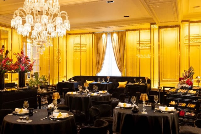 Chateau Restaurant Joel Robuchon dining room with gold paneling for executive dinners or gala events.