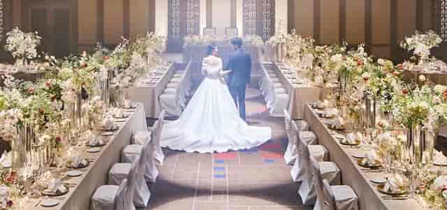 Luxury ballroom wedding setup at Imperial Hotel Tokyo with elegant floral centerpieces.