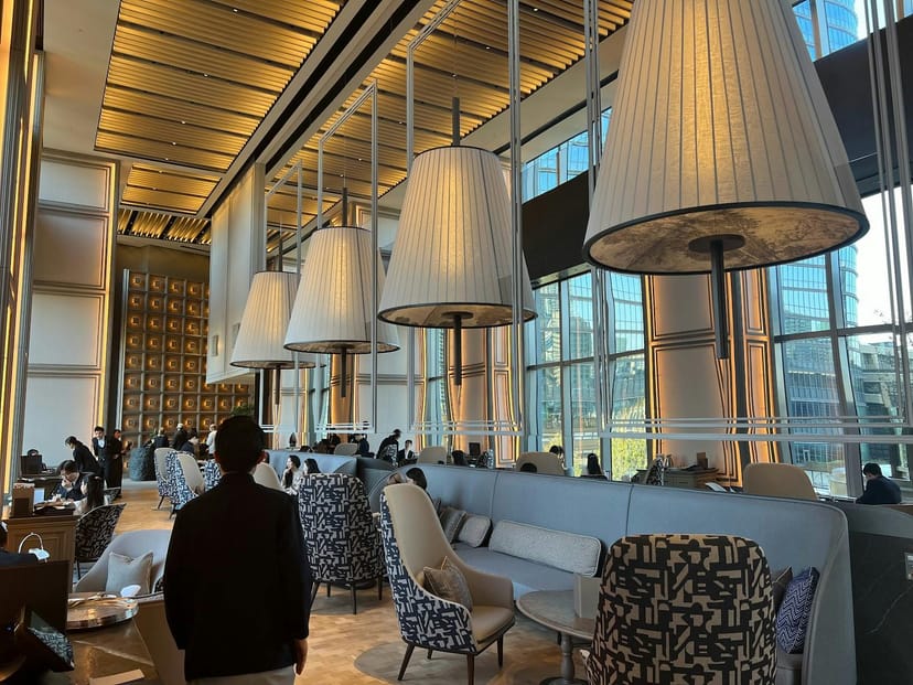 Janu Grill sophisticated breakout space with plush seating for VIP corporate networking events.