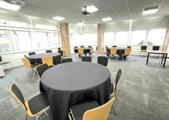 Cabaret-style workshop space at Edmund House featuring breakout rounds for corporate events.