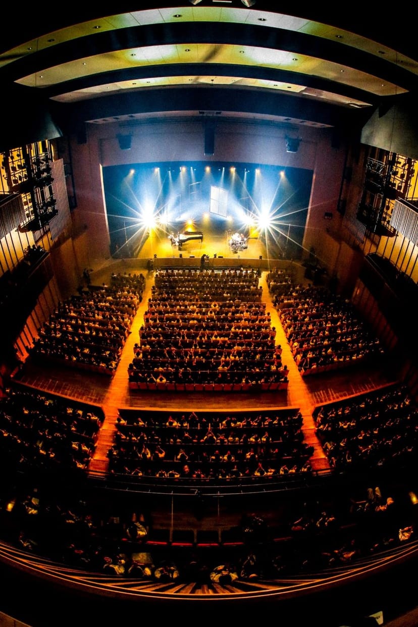 LINE CUBE SHIBUYA plenary session with stage lighting for corporate events and conferences.