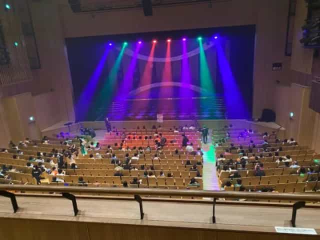 VIP seating at LINE CUBE SHIBUYA with colorful stage lighting for corporate event or conference.