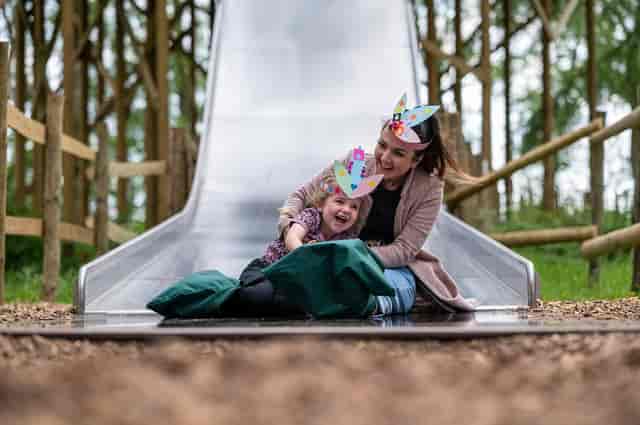 Cheshire Outdoors family activity area with interactive play equipment for team building events.