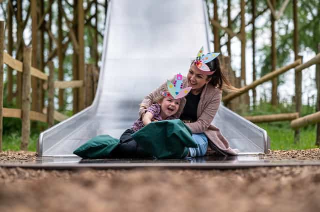 Cheshire Outdoors family activity area with interactive play equipment for team building events.