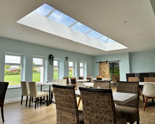 Cammies Restaurant airy event space with natural light for networking and breakfast briefings.