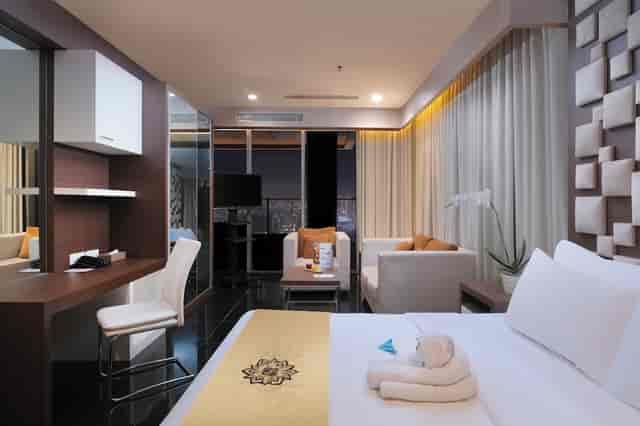 VIP guest room with workspace and lounge at Merlynn Park Hotel, ideal for business travel and events.