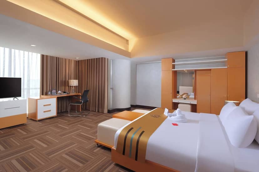 Contemporary Merlynn Park Hotel guest room with workspace for corporate travel and VIP events.