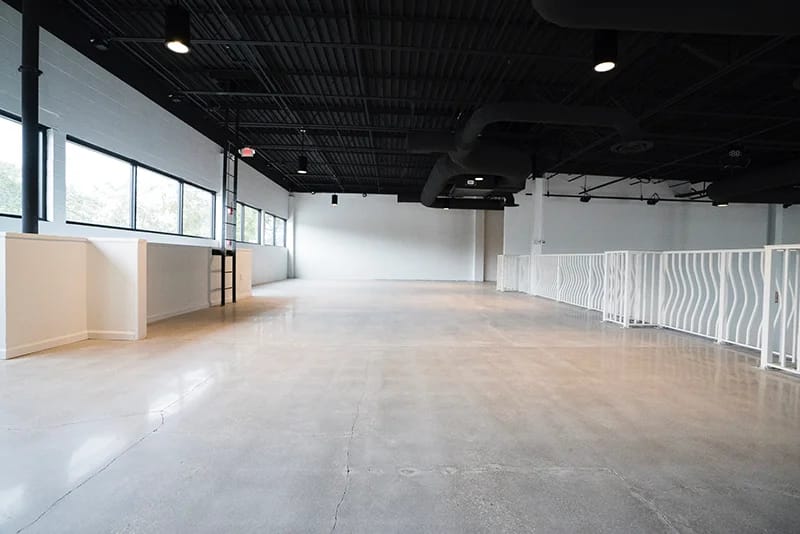 Industrial-chic Canvas Event Venue with concrete floors for corporate activations and galas.