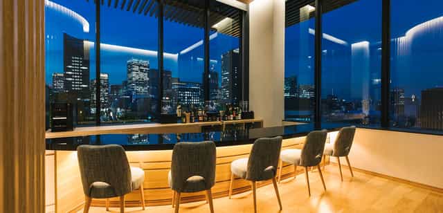 Hotel Yaenomidori Tokyo lobby with floor-to-ceiling city views for VIP cocktail receptions.