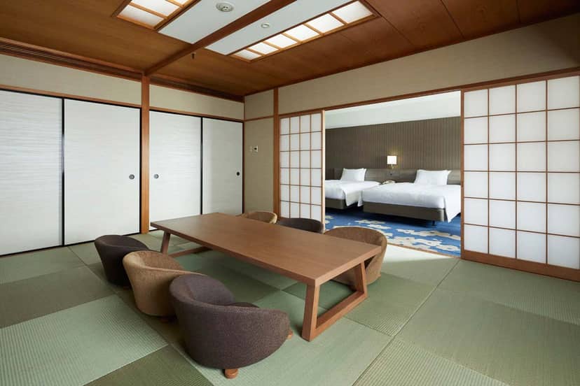 Japanese-style hotel suite featuring boardroom setup for business meetings and corporate events.
