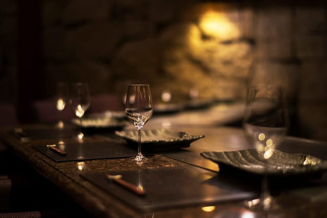 Teppanyaki YAMAHIKO dining setup: elegant stone interior for VIP board dinner and corporate events.
