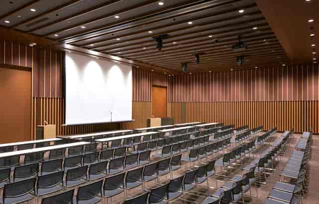 Nihonbashi Hall theater-style conference room with wood panels for corporate seminars and meetings.