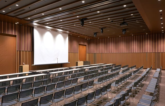 Nihonbashi Hall theater-style conference room with wood panels for corporate seminars and meetings.