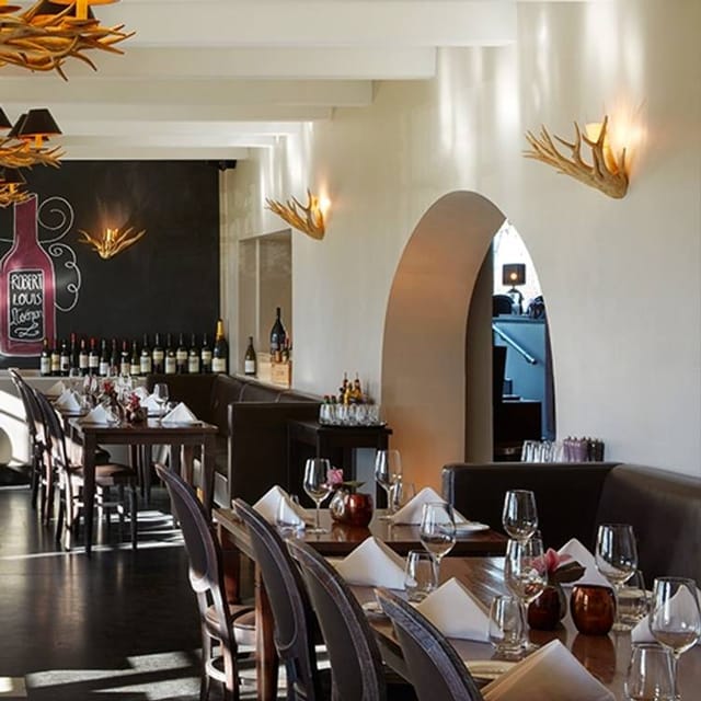 Rustic Gerbermühle restaurant with banquette seating for corporate dinners and VIP events.