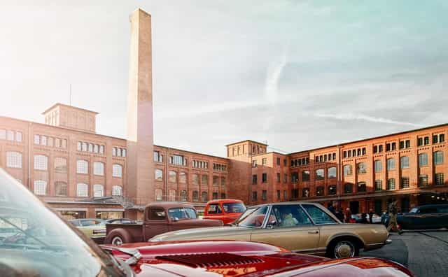 Industrial-chic Kiesfläche event space with brick architecture for car launches and corporate events.