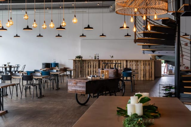 Industrial-chic Mainfloor at Maindock with pallet bar for networking and corporate events.