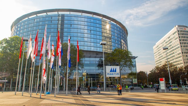 Modern convention hotel with expansive plaza for large-scale corporate events and conferences.
