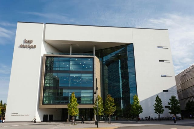 Modern Kap Europa conference room exterior, sleek professional venue for corporate event launches.