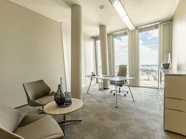 Minimalist executive suite in Nextower for high-stakes business meetings and private consultations.