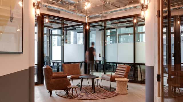 Modern Mindspace Eurotheum meeting room with industrial decor for brainstorming and client sessions.