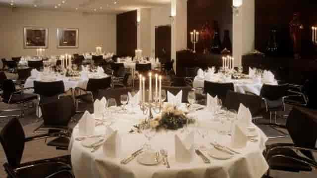 Formal banquet hall at Metropolitan Hotel with elegant candelabra for corporate gala or awards.