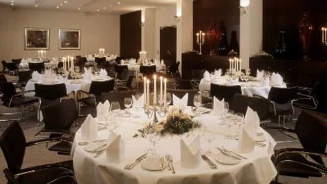 Formal banquet hall at Metropolitan Hotel with elegant candelabra for corporate gala or awards.