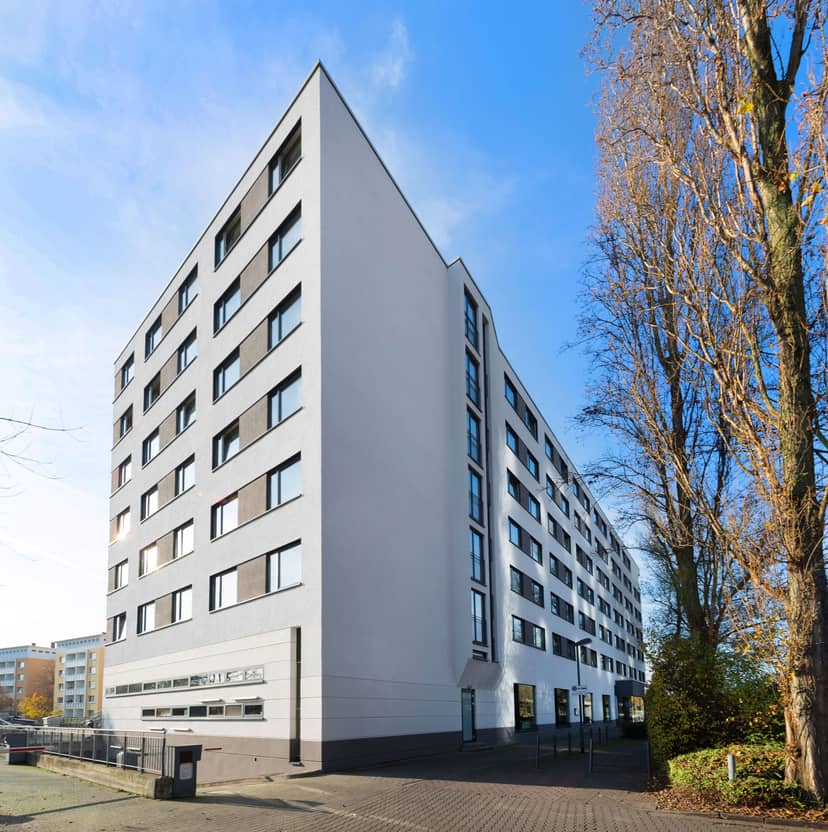 Hotel Frankfurt Messe modern exterior for corporate training and business event room blocks.