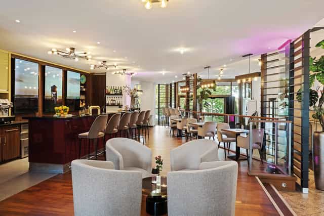 Contemporary lounge at Leonardo Royal Hotel Frankfurt for corporate networking and breakout events.