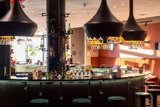 Scandic Hotels bar lounge with high-top seating for professional networking and event receptions.