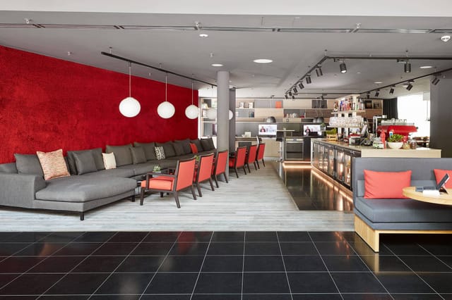 Modern lounge with modular seating for corporate networking and business coffee breaks.