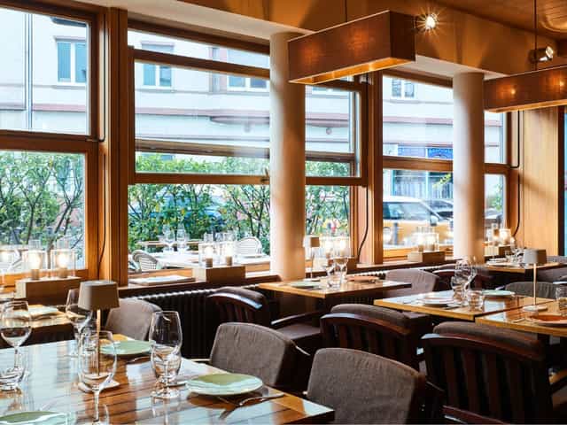 Isoletta Restaurant, minimalist dining area for corporate dinners and high-end business events.