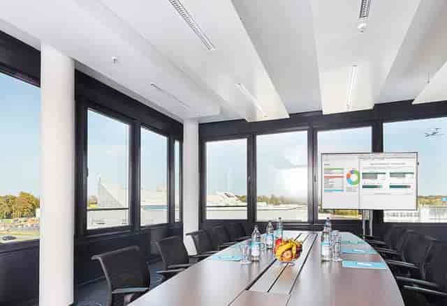 Modern boardroom with floor-to-ceiling windows for corporate meetings and business strategy events.