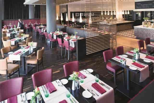 Mövenpick restaurant with banquette seating for corporate lunch and networking dinner events.