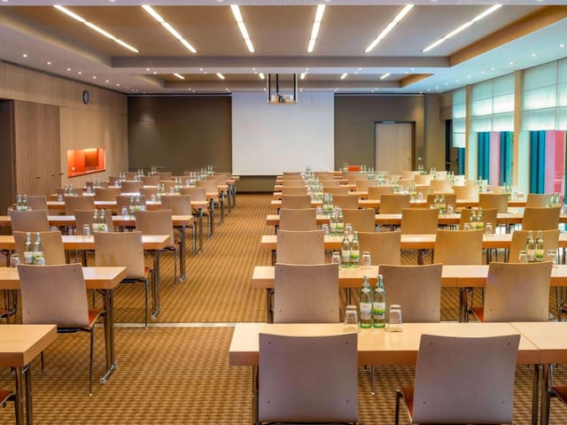 Private dining area at Mövenpick for corporate training and seminars with classroom-style seating.