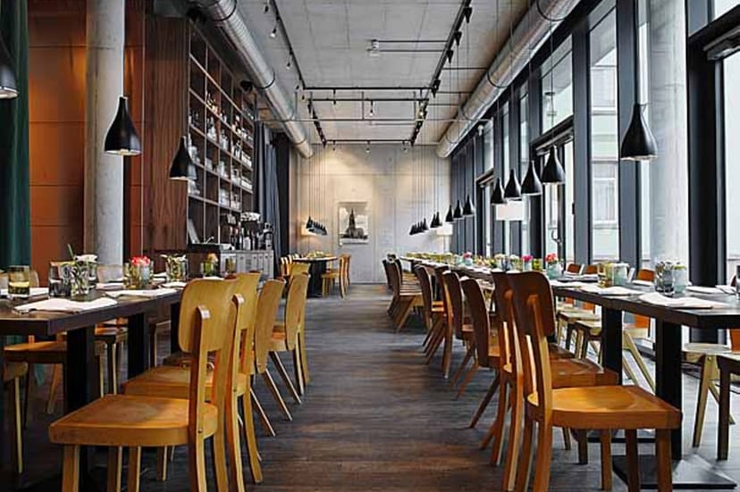 Modern industrial restaurant venue for corporate dinners and networking events.