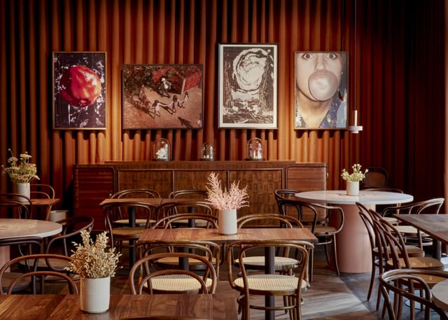 Intimate breakout space with velvet curtains for high-end corporate meetings and workshops.