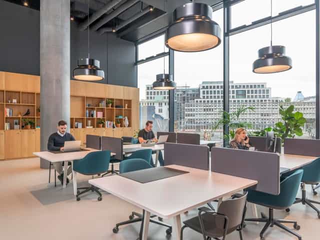 Modern private office at Spaces Omniturm with ergonomic desks for flexible coworking meetings.