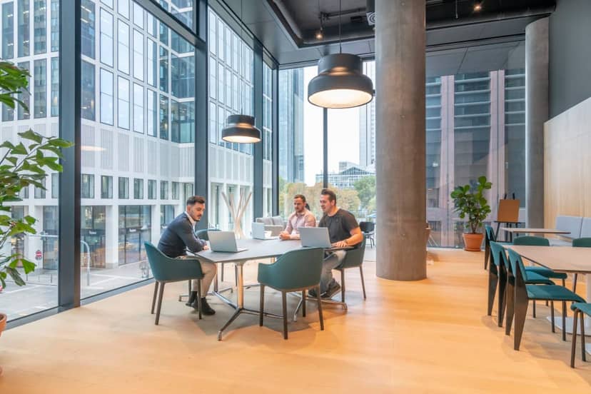 Modern private office breakout space for agile collaboration and professional networking.
