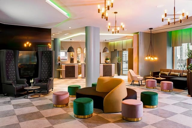 Leonardo Hotel Offenbach lobby with modular furniture for business events and networking.