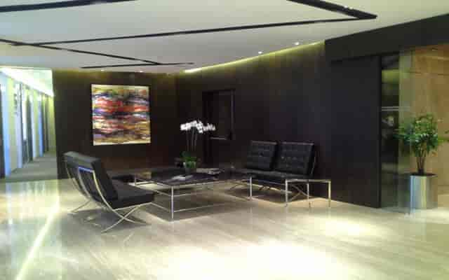 Executive breakout room in AXA Tower with minimalist design for corporate events and conferences.