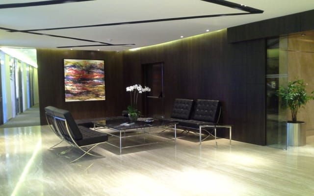 Executive breakout room in AXA Tower with minimalist design for corporate events and conferences.